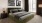 a bedroom with a bed and lamps