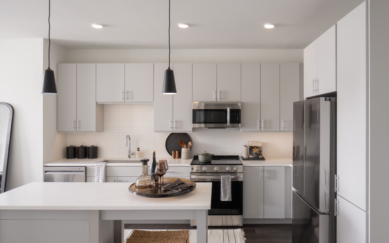 kitchen with stainless steel appliances  and ample cabinets with a large island