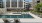 a pool in a courtyard with buildings around it