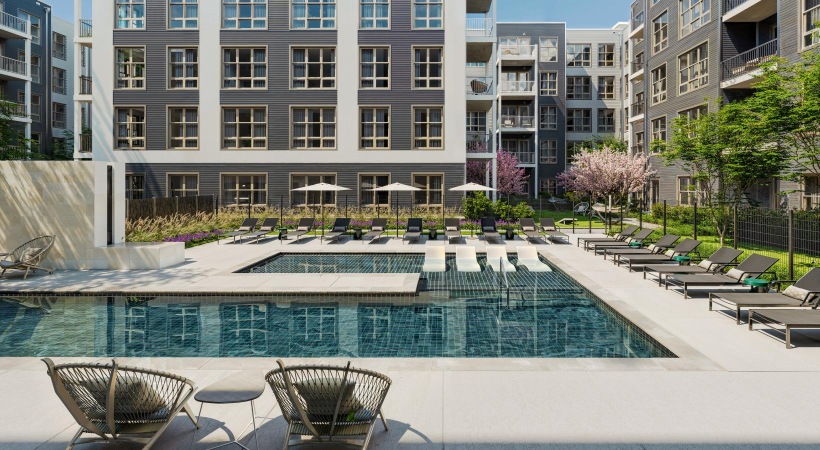 a pool in a courtyard with buildings around it