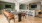 a kitchen with a table and chairs