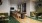 a spacious room with a dining table and couches