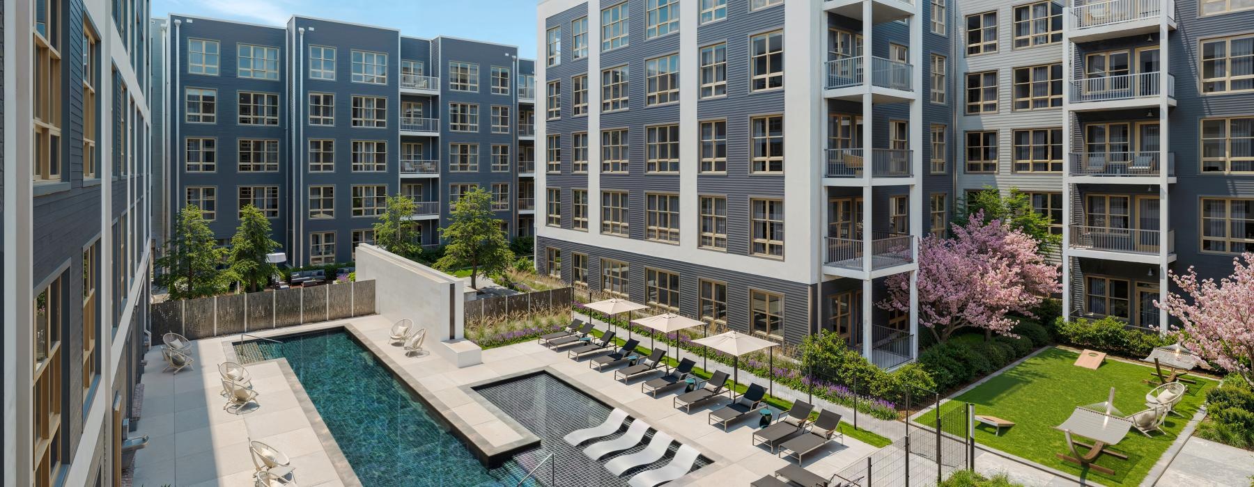 a pool in a courtyard between buildings