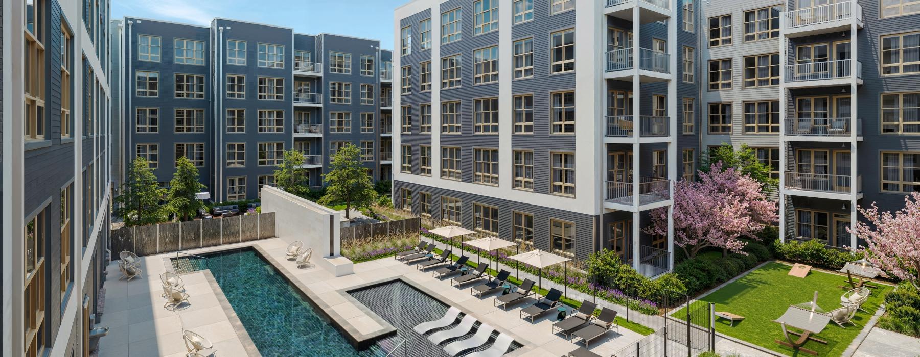a pool in a courtyard between buildings